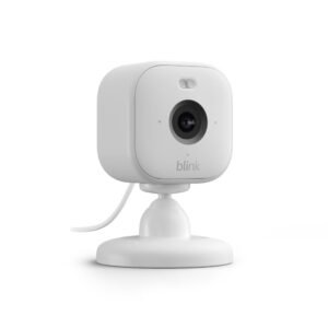 Blink Mini 2 smart home security camera placed on a table with built-in spotlight